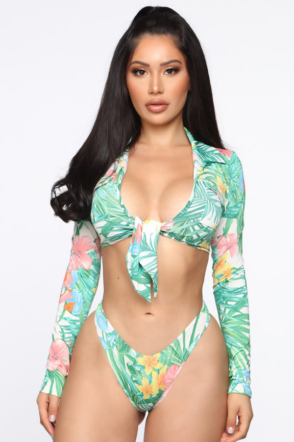 Long sleeve high waist bikini with tropical floral and leaf print, featuring a tie-front top.