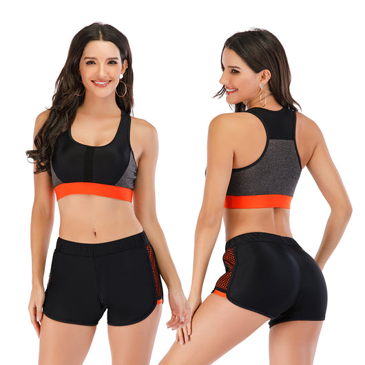 Black and orange sports vest bikini set with boxer shorts and mesh side panels modeled by a woman. - Image 10