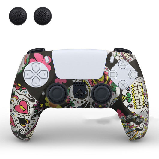 PS5 controller with a white silicone sleeve featuring a vibrant, abstract eye pattern, shown with two black thumb grip caps.
