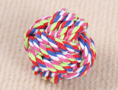 Three colorful knotted cotton rope ball dog toys in various sizes on a light beige surface. - Image 5