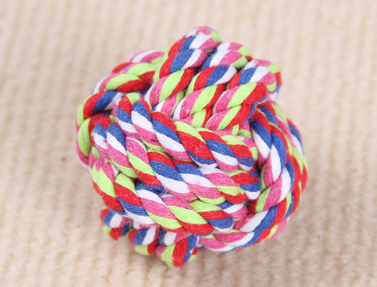 Three colorful knotted cotton rope ball dog toys in various sizes on a light beige surface. - Image 4