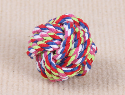 Three colorful knotted cotton rope ball dog toys in various sizes on a light beige surface. - Image 2