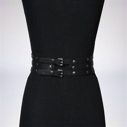 Women's black leather waist belt with three layers, silver-tone metal O-rings, and rivets on a black mannequin. - Image 5