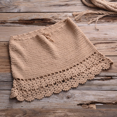 Black crocheted off-the-shoulder crop top with short sleeves and a lace-up front featuring tassels. - Image 13