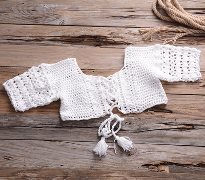 Black crocheted off-the-shoulder crop top with short sleeves and a lace-up front featuring tassels. - Image 10