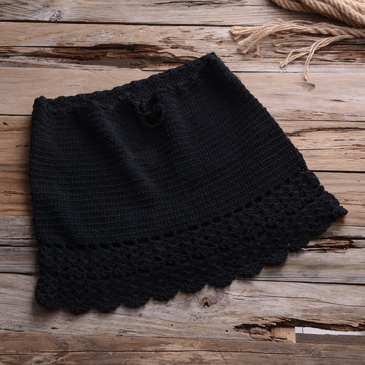 Black crocheted off-the-shoulder crop top with short sleeves and a lace-up front featuring tassels. - Image 11