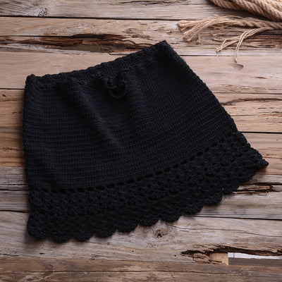 Black crocheted off-the-shoulder crop top with short sleeves and a lace-up front featuring tassels. - Image 4