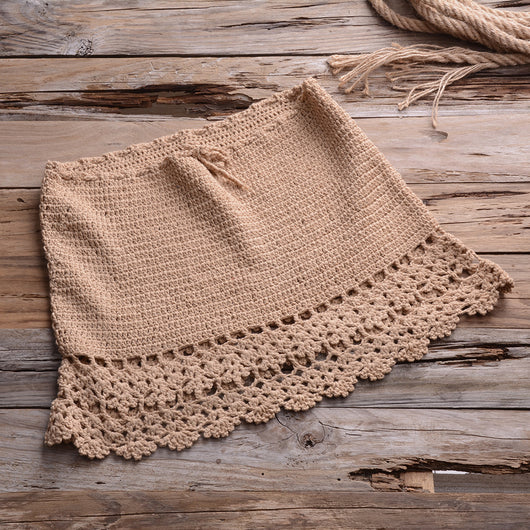 Black crocheted off-the-shoulder crop top with short sleeves and a lace-up front featuring tassels. - Image 6