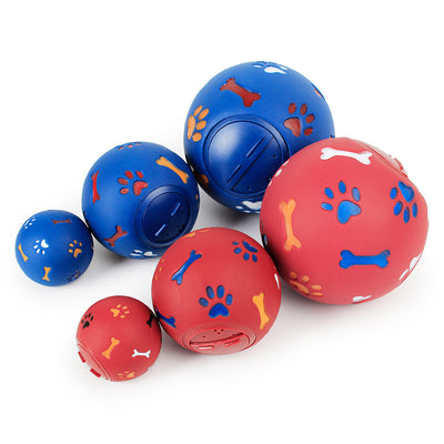 Red rubber pet toy with paw print and bone cutouts, featuring a rotating treat-dispensing mechanism. - Image 5