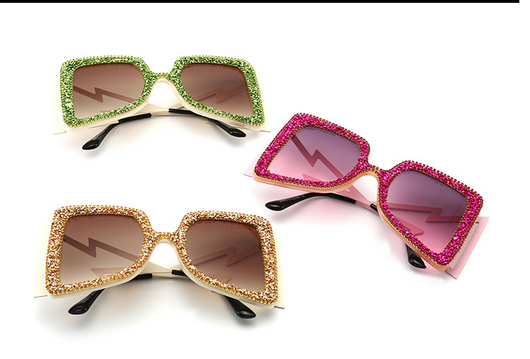 Women's oversized square sunglasses with cream frames, green rhinestones, brown gradient lenses, and lightning bolt temples. - Image 9