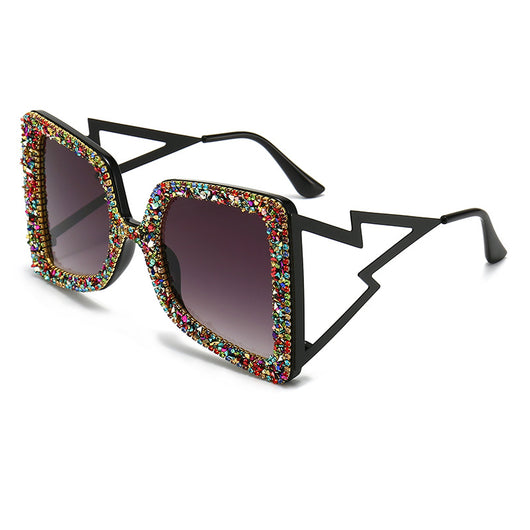 Women's oversized square sunglasses with cream frames, green rhinestones, brown gradient lenses, and lightning bolt temples. - Image 3