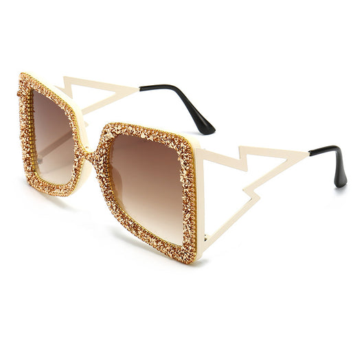 Women's oversized square sunglasses with cream frames, green rhinestones, brown gradient lenses, and lightning bolt temples. - Image 5