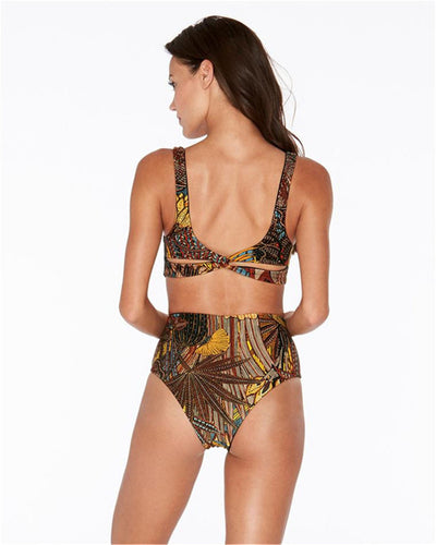 One-piece swimsuit with a vibrant tropical leaf print in yellow, brown, and blue, featuring stylish side cut-outs. - Image 2