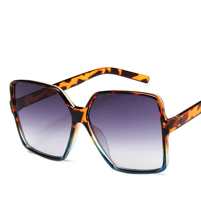Trendy oversized sunglasses with black and tortoiseshell frames and gradient grey lenses, angled on a white background. - Image 13