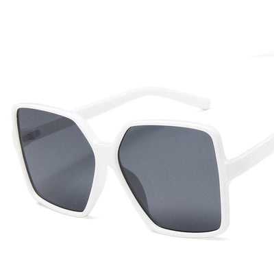 Trendy oversized sunglasses with black and tortoiseshell frames and gradient grey lenses, angled on a white background. - Image 9