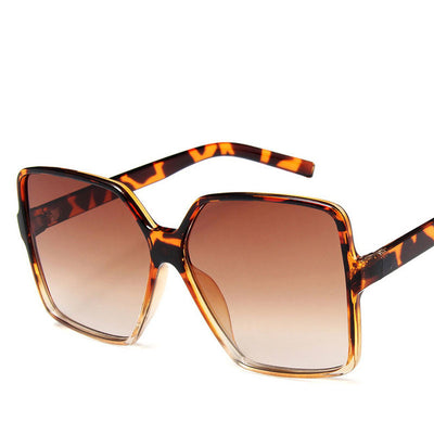 Trendy oversized sunglasses with black and tortoiseshell frames and gradient grey lenses, angled on a white background. - Image 7