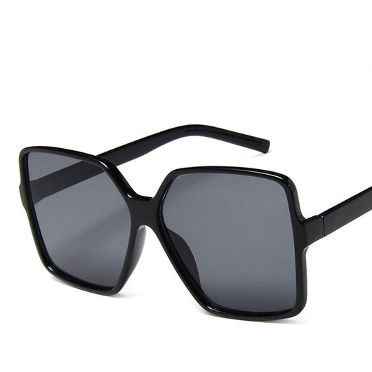 Trendy oversized sunglasses with black and tortoiseshell frames and gradient grey lenses, angled on a white background. - Image 2
