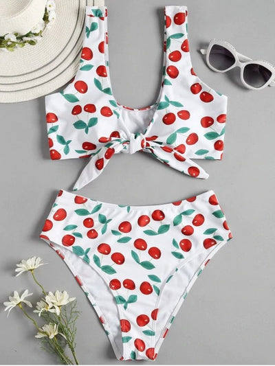 White two-piece bikini swimsuit with red cherry print, featuring a tie-front V-neck top and high-waisted bottoms. - Image 4