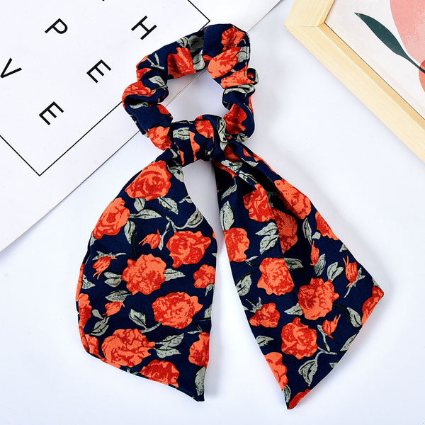 Moño Perla con Lazo Floral - Goma Elástica para Cabello Elegante