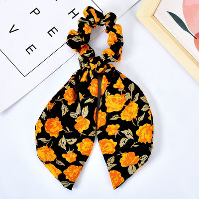 Moño Perla con Lazo Floral - Goma Elástica para Cabello Elegante