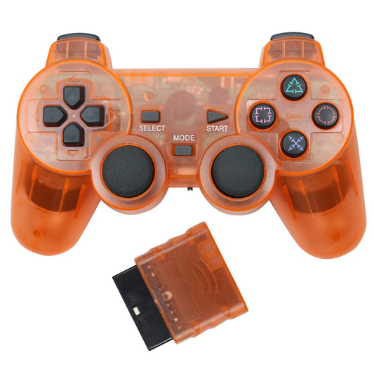 Orange transparent wireless game controller for PS2 with black buttons and a matching orange receiver. - Image 2