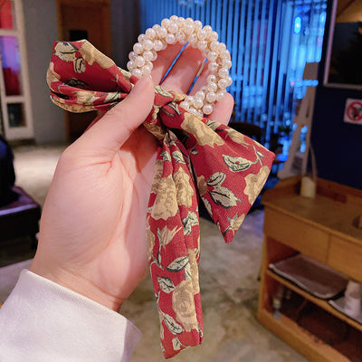 Moño Perla con Lazo Floral - Goma Elástica para Cabello Elegante - Image 4