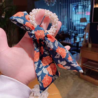 Moño Perla con Lazo Floral - Goma Elástica para Cabello Elegante - Image 5