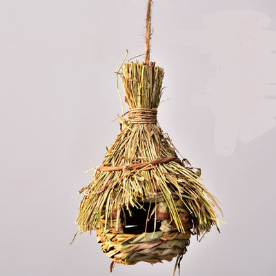 Hand-knitted straw bird's nest with a dome shape and small entrance, hanging by a twine loop. - Image 12
