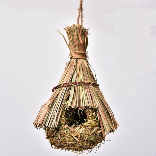 Hand-knitted straw bird's nest with a dome shape and small entrance, hanging by a twine loop. - Image 4