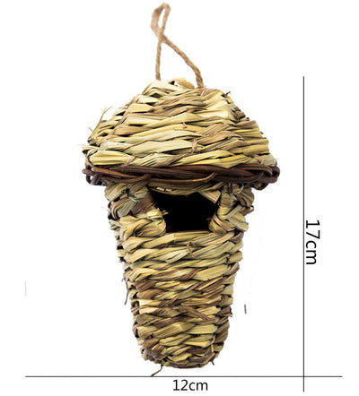 Hand-knitted straw bird's nest with a dome shape and small entrance, hanging by a twine loop. - Image 6