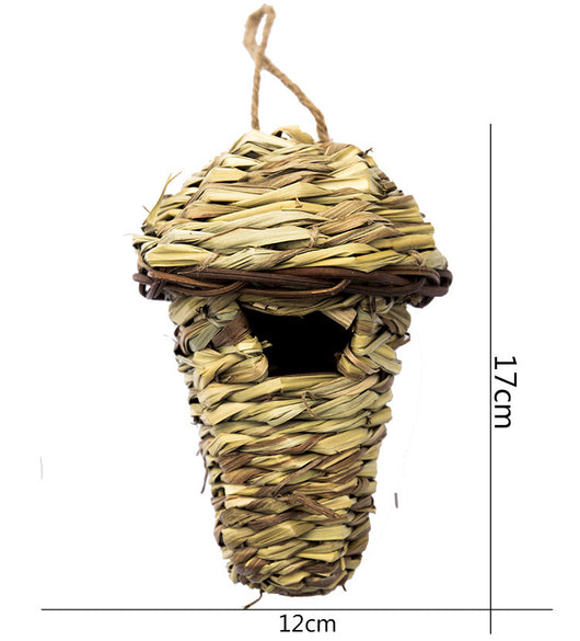 Hand-knitted straw bird's nest with a dome shape and small entrance, hanging by a twine loop. - Image 6