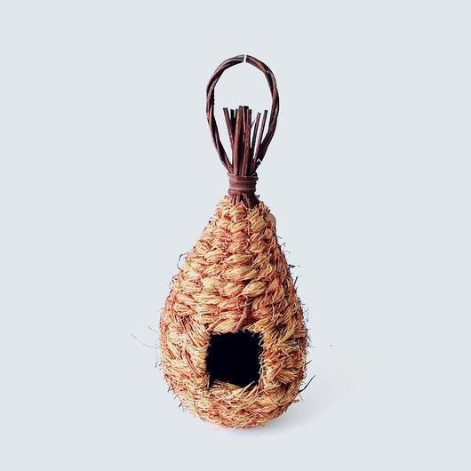 Hand-knitted straw bird's nest with a dome shape and small entrance, hanging by a twine loop. - Image 9