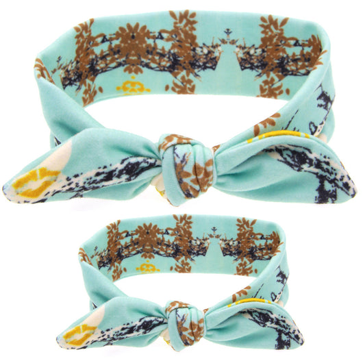 Two blue headbands with white polka dots and knotted bows, one adult-sized and one child-sized, for a matching set. - Image 22