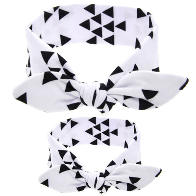 Two blue headbands with white polka dots and knotted bows, one adult-sized and one child-sized, for a matching set. - Image 20