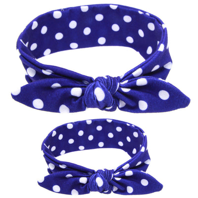 Two blue headbands with white polka dots and knotted bows, one adult-sized and one child-sized, for a matching set. - Image 23