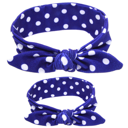 Two blue headbands with white polka dots and knotted bows, one adult-sized and one child-sized, for a matching set. - Image 23