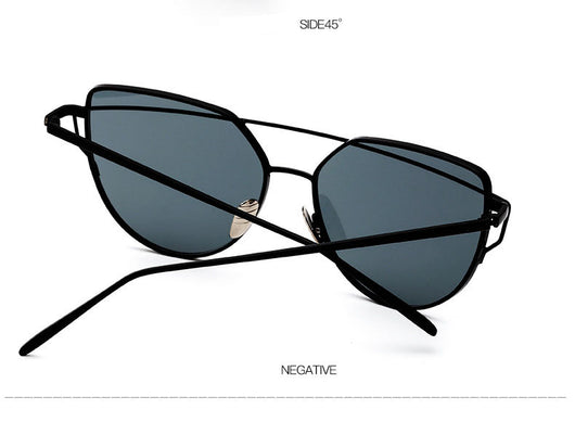 Gold metal cat-eye sunglasses with pink mirrored lenses on a white background. - Image 10