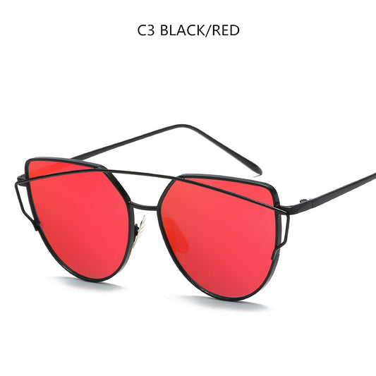 Gold metal cat-eye sunglasses with pink mirrored lenses on a white background. - Image 2