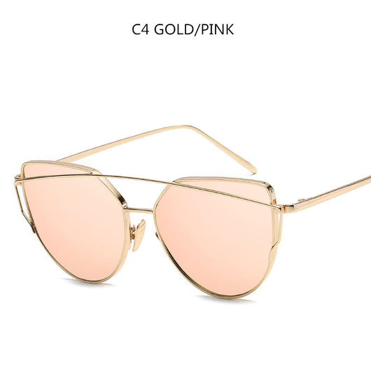 Gold metal cat-eye sunglasses with pink mirrored lenses on a white background. - Image 3