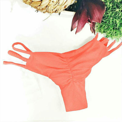 Black solid color bikini bottom with a high-cut leg and a wide, folded cross strap waistband. - Image 9