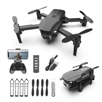 Gray folding drone with 4K camera, remote control, spare propellers, propeller guards, charging cable, and battery.