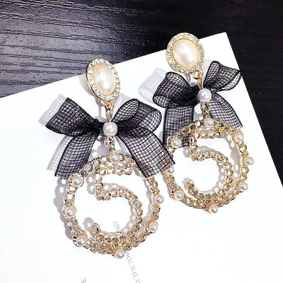 Aretes Circulares Dorados con Perla y Moño - Diseño Elegante y Trendy - Image 3