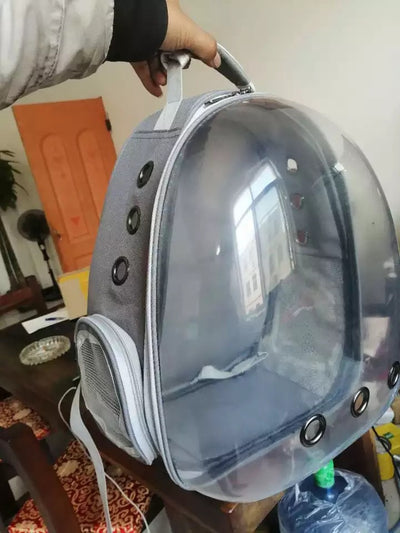 Black and white penguin-shaped pet carrier backpack with a transparent bubble window and ventilation holes. - Image 34