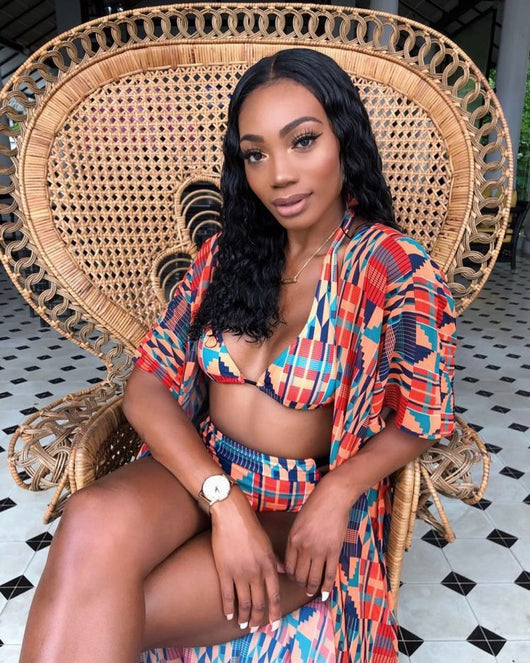 Woman wearing a red, orange, and blue geometric print three-piece swimsuit with a high-waisted bikini and long kimono cover-up. - Image 7