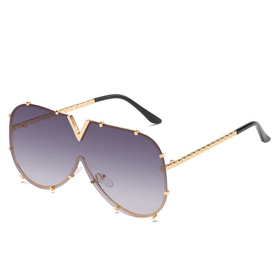 V-shaped one-piece lens frog sunglasses with a gold frame and gradient purple to pink lenses. - Image 7
