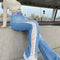 Women's High-Waisted Bootcut Jeans with Cutout Details and Vintage Wash