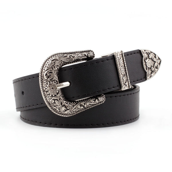 Black imitation leather women's belt with an ornate silver-tone square pin buckle and matching engraved tip.