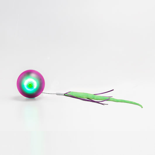 Electric cat toy with a glowing purple and green ball, attached to a fuzzy green tail with purple ribbons. - Image 8