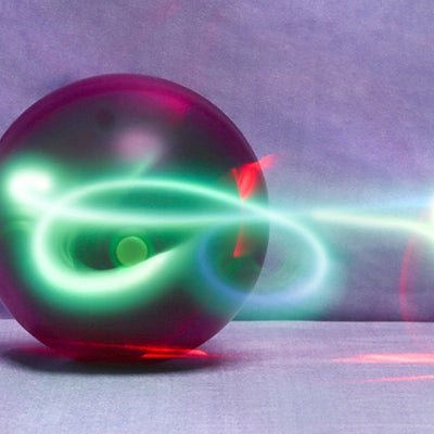 Electric cat toy with a glowing purple and green ball, attached to a fuzzy green tail with purple ribbons. - Image 11