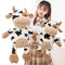 Muñeca Vaca Marrón Año del Buey - Juguete de Grúa
